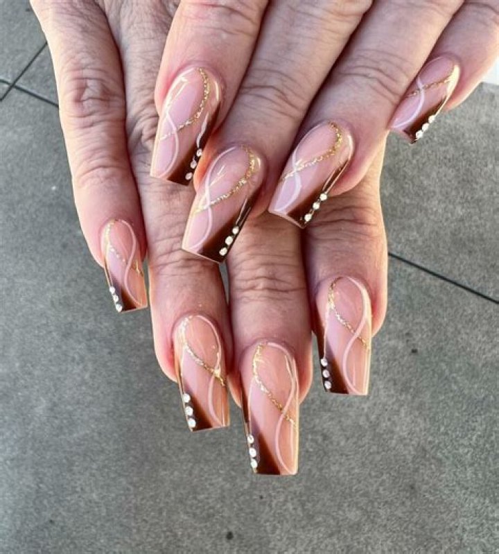 Luxurious Gold And Burgundy Nails: A Dazzling Duo